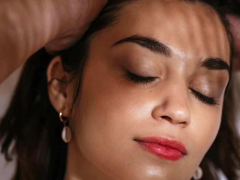 Image of model with eyes closed and healthy hair