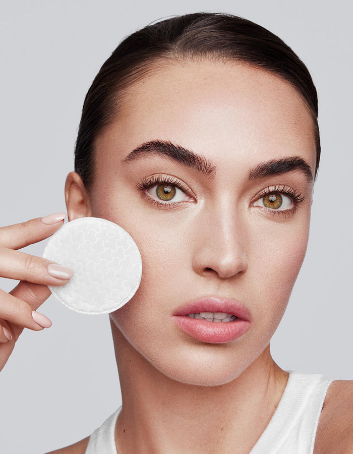 model cleansing eye with cotton round