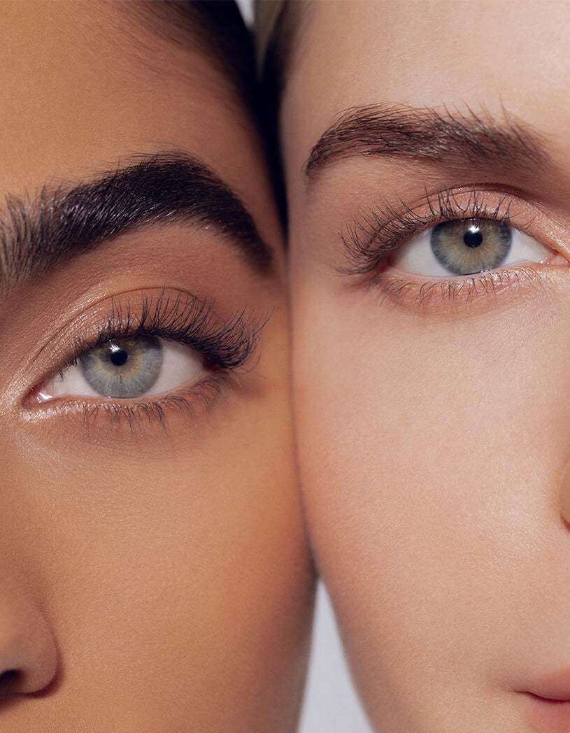 two models with full lashes and thick brows